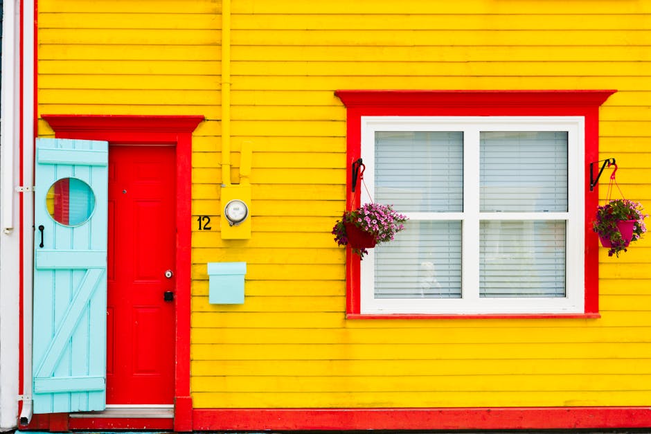 Vibrant yellow wall and red door 12